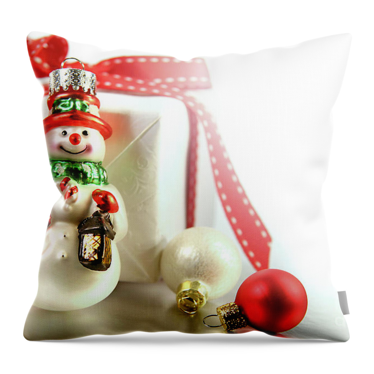 Background Throw Pillow featuring the photograph Small christmas ornament with gift by Sandra Cunningham