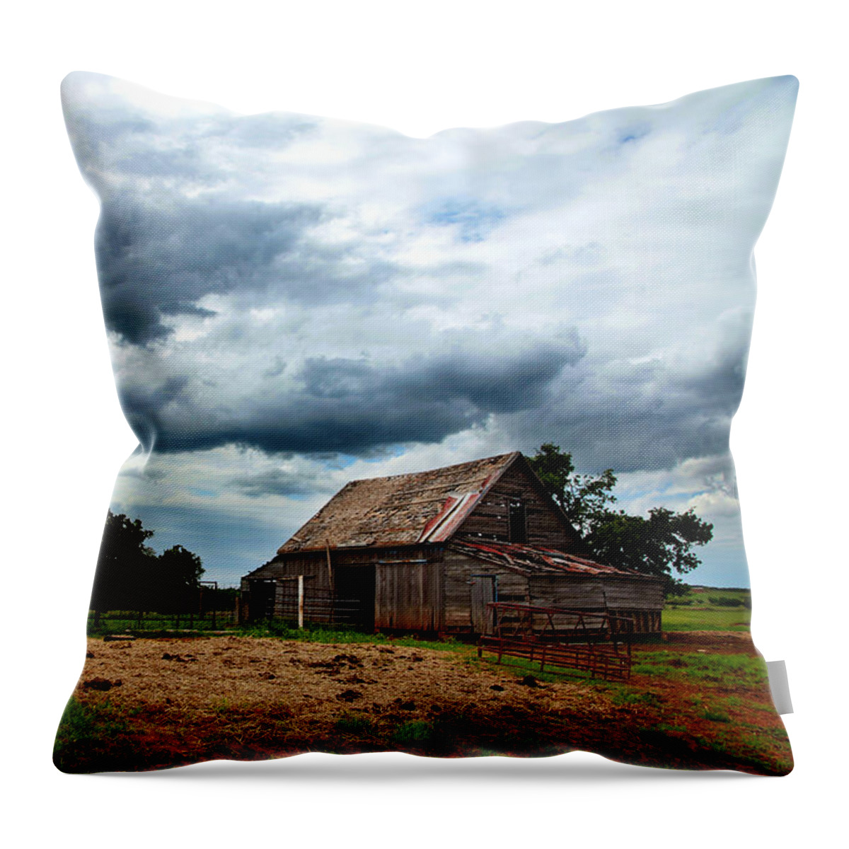 Barn Throw Pillow featuring the photograph Storms loom over Barn on the Prairie by Toni Hopper