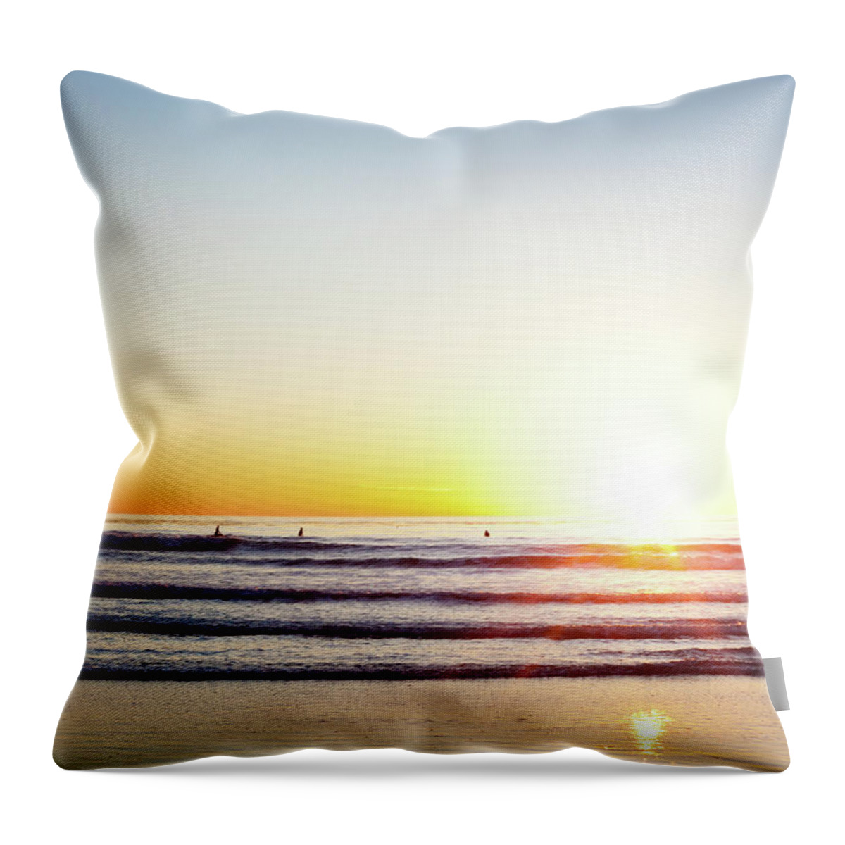 Orange Color Throw Pillow featuring the photograph Sunset Surfers by Ianmcdonnell