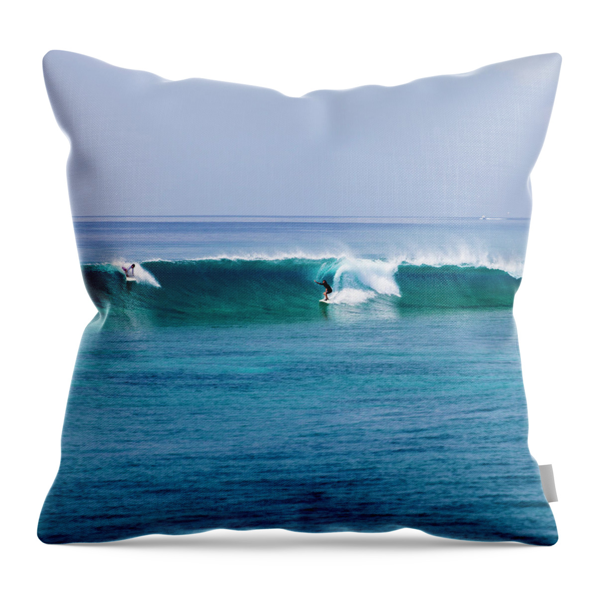Recreational Pursuit Throw Pillow featuring the photograph Surfers Surfing A Wave by Subman