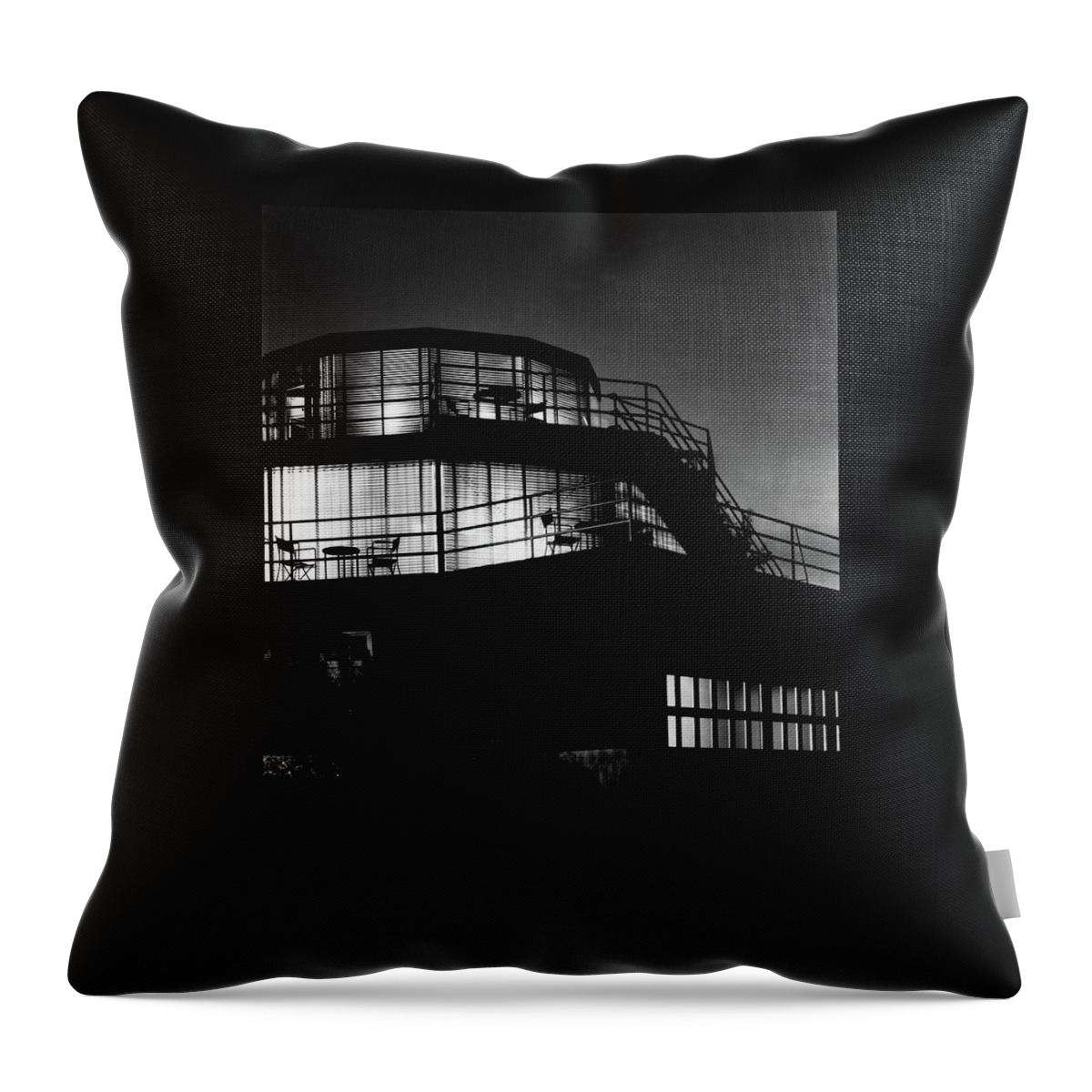 The Exterior Of A Spiral House Design At Night Throw Pillow