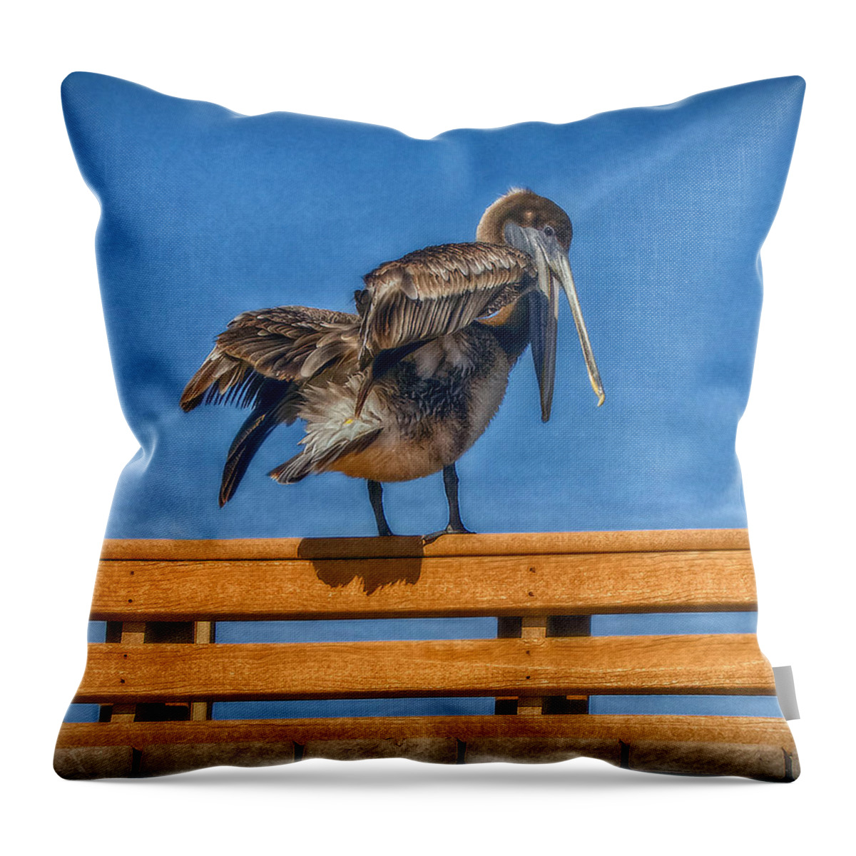 Pelican Throw Pillow featuring the photograph The Pelican by Hanny Heim