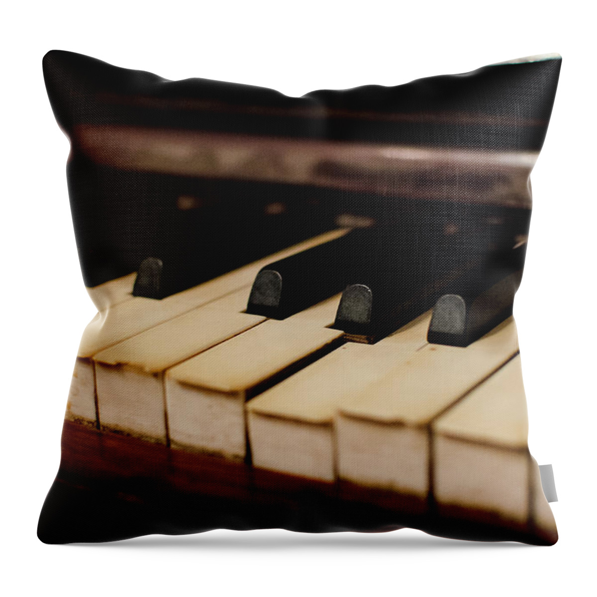 Piano Throw Pillow featuring the photograph Timeworn Piano Keys by Megan Ahrens