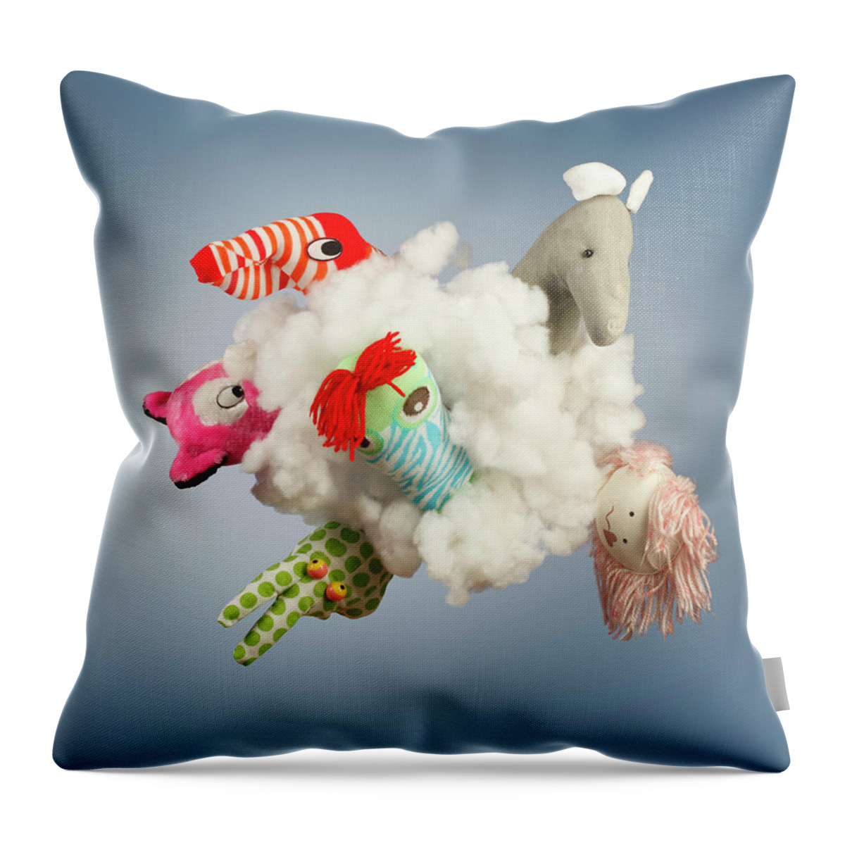 Newcraft Throw Pillow featuring the photograph Toy Figure In Cloud by Paul Taylor