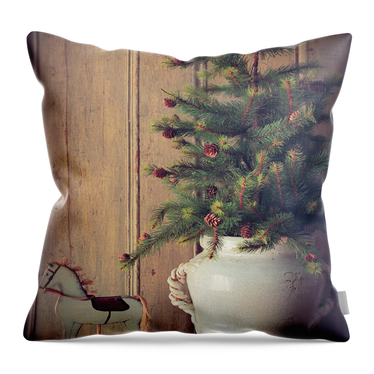 Decoration Throw Pillow featuring the photograph Toy horse with Christmas tree on table by Sandra Cunningham