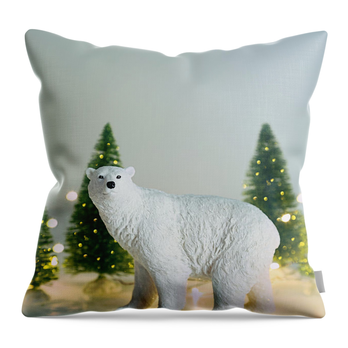 Christmas Throw Pillow featuring the photograph Toy polar bear with little trees and lights by Sandra Cunningham