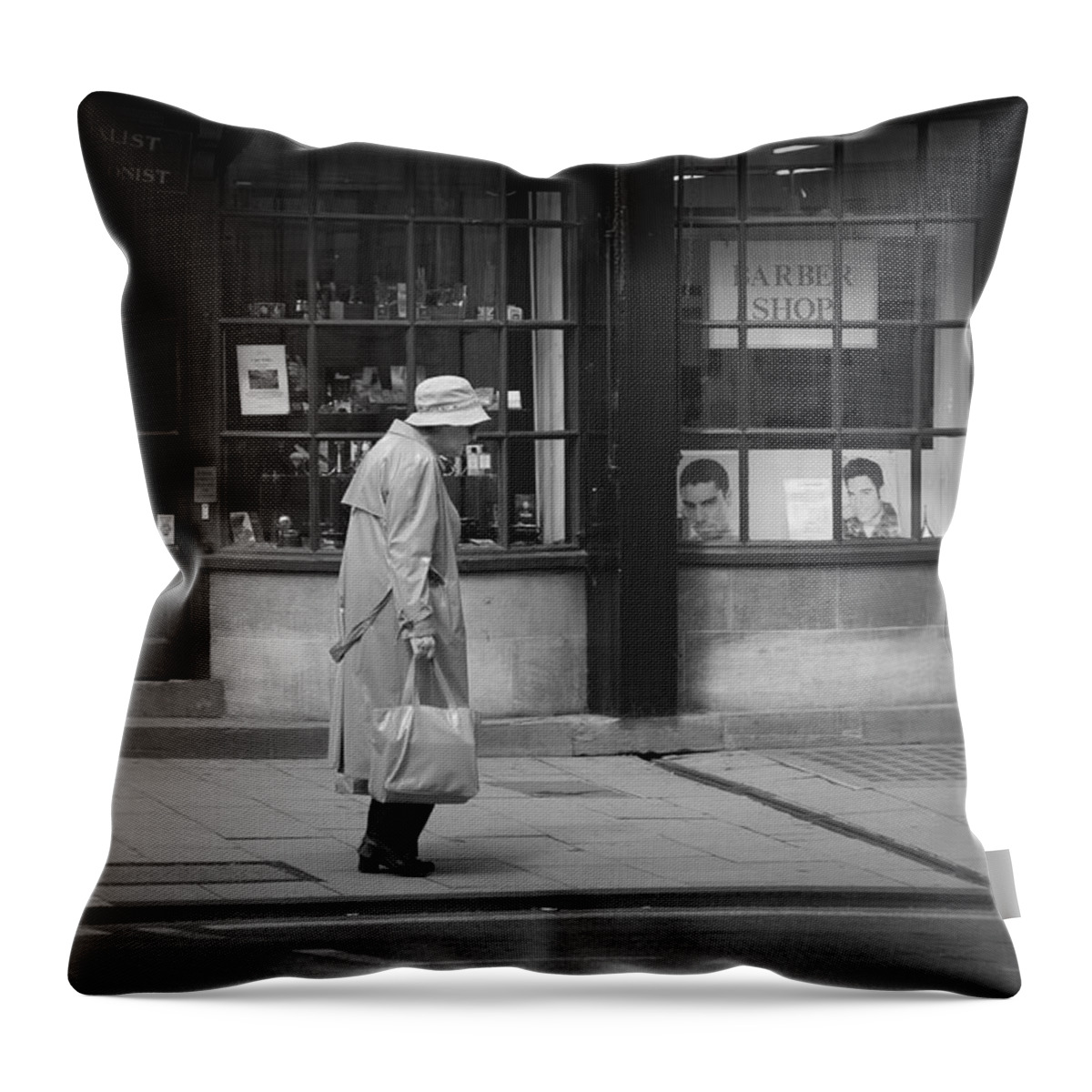 Loneliness Throw Pillow featuring the photograph Walking down the street by Chevy Fleet