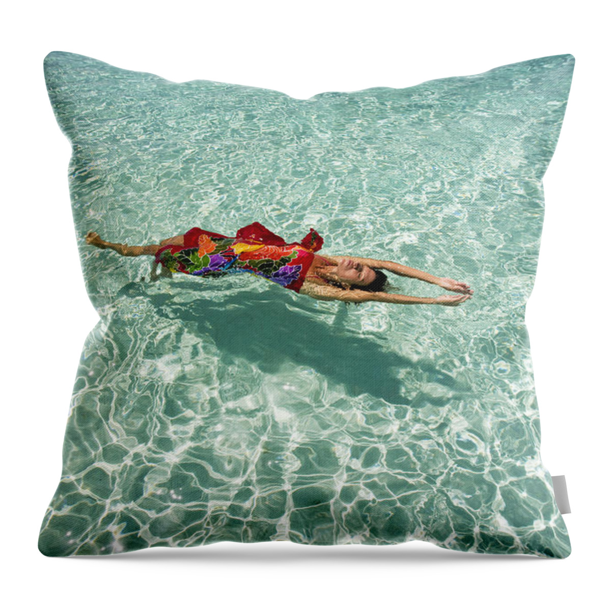 Daydream Throw Pillow featuring the photograph Woman floating in tropical ocean by M Swiet Productions