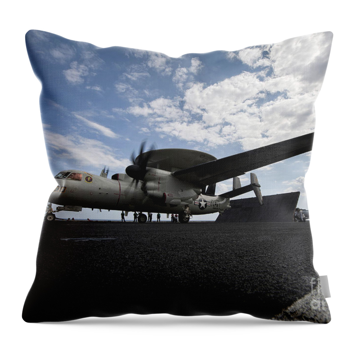 Motioning Throw Pillow featuring the photograph An E-2c Hawkeye Aircraft Prepares by Stocktrek Images