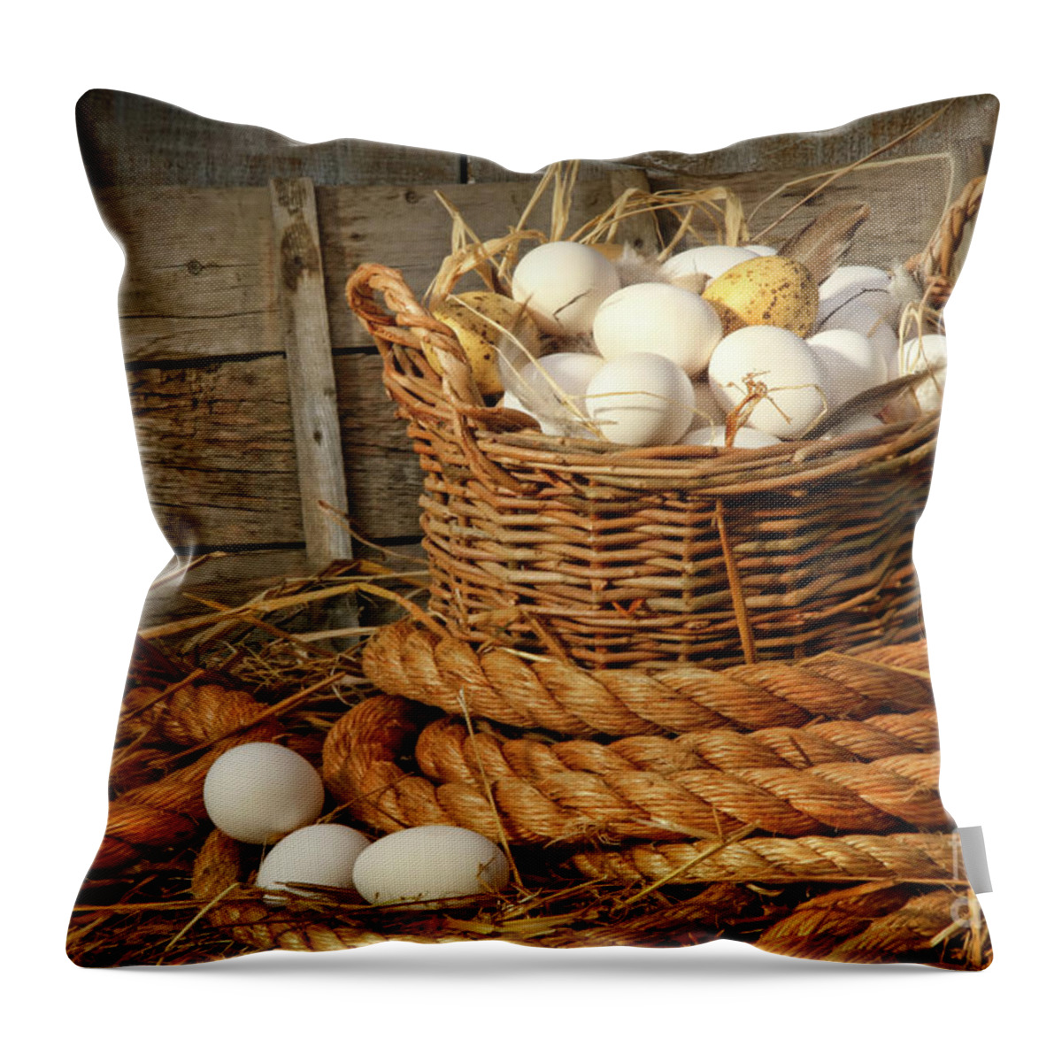 Agriculture Throw Pillow featuring the photograph Basket of eggs on straw by Sandra Cunningham