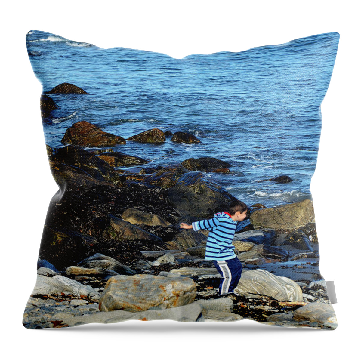 Boy Throw Pillow featuring the photograph Boy Throwing a Stone Maine Coast by Maureen E Ritter