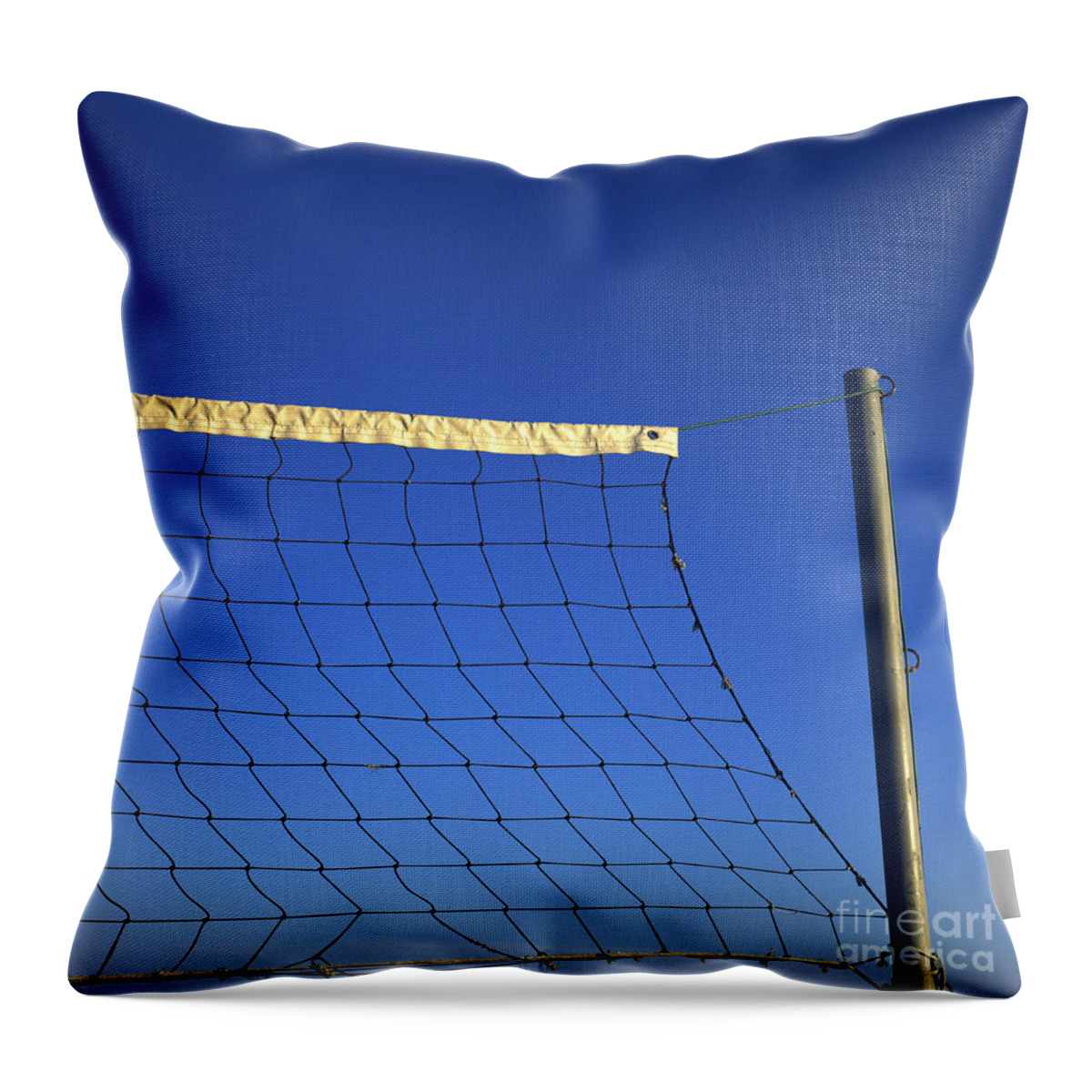 Net Throw Pillow featuring the photograph Close-up of a volleyball net abandoned. by Bernard Jaubert