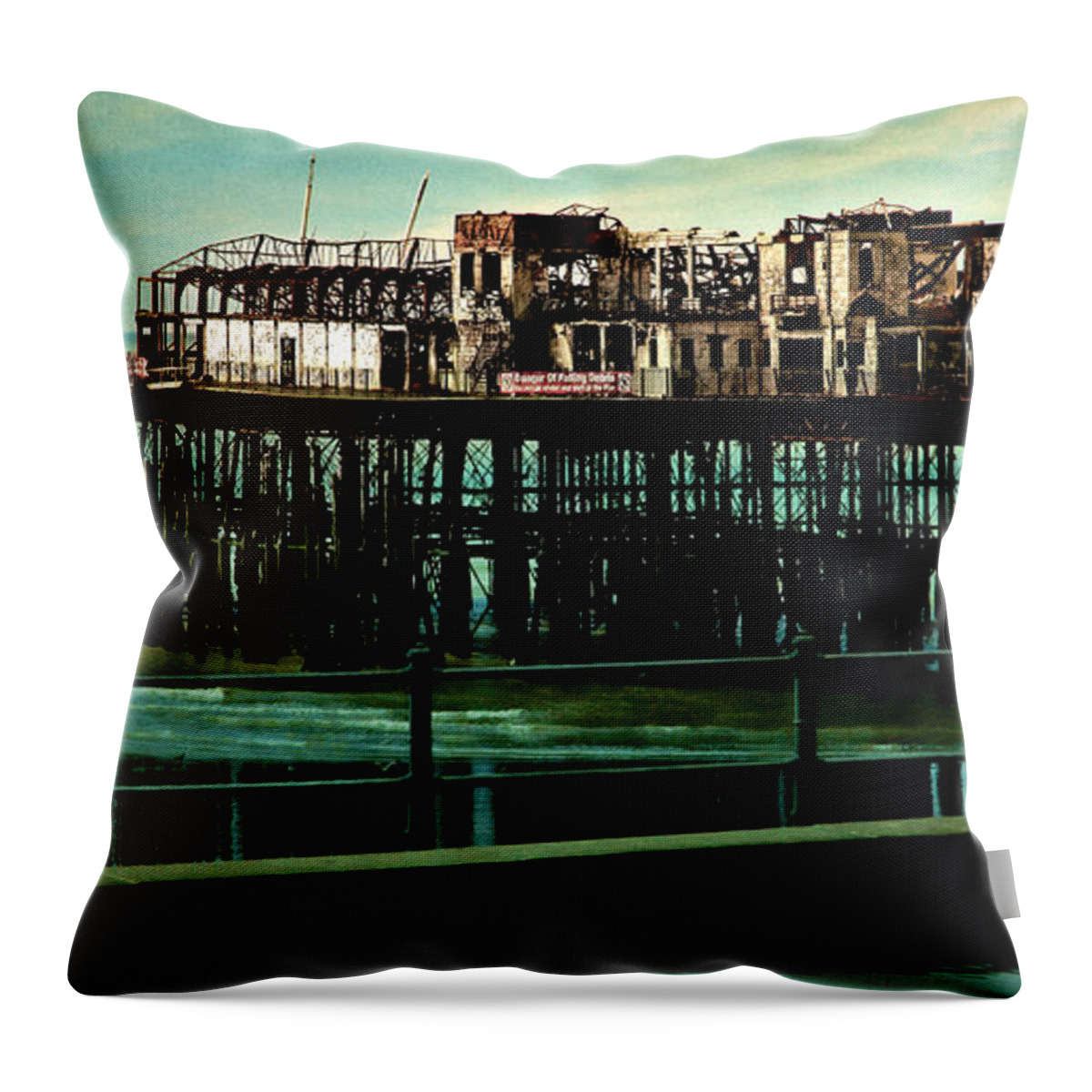 Damage Throw Pillow featuring the photograph Hastings Pier by Chris Lord
