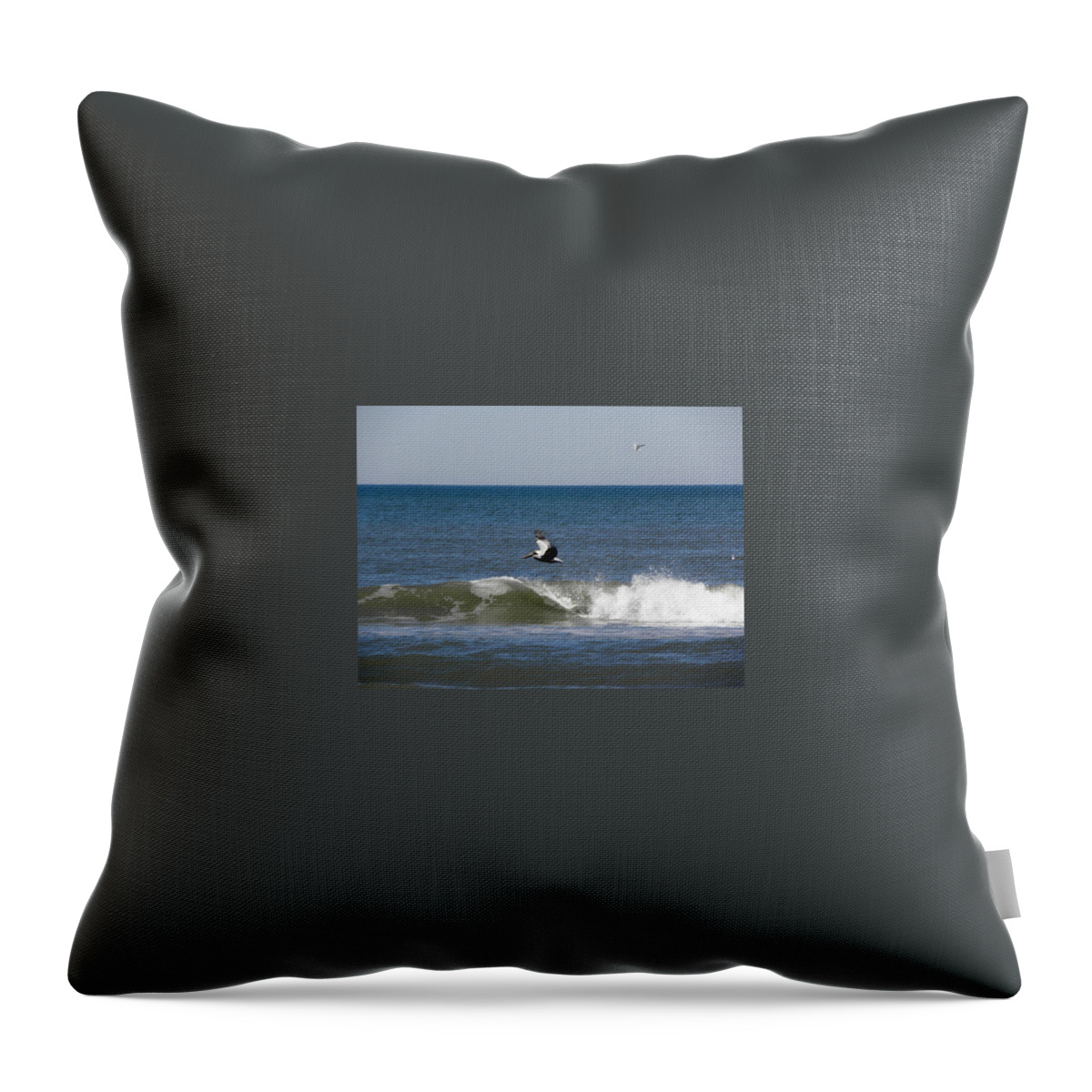 Pelican Throw Pillow featuring the photograph Pelican Wave Surfer by Kim Galluzzo