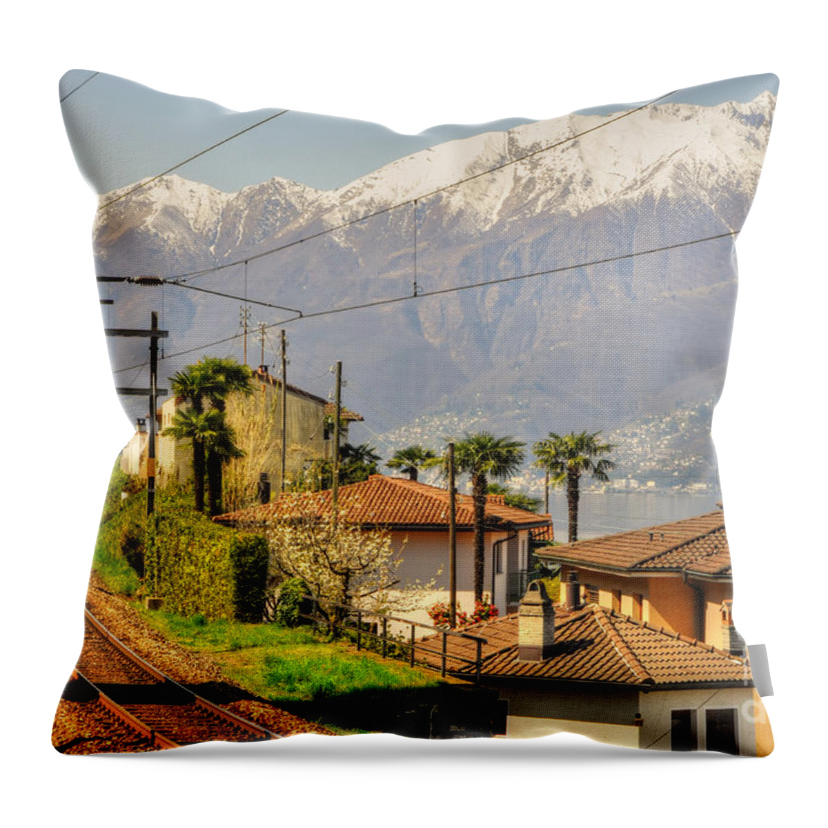 Railroad Tracks Throw Pillow featuring the photograph Railroad tracks and snow-capped mountain by Mats Silvan