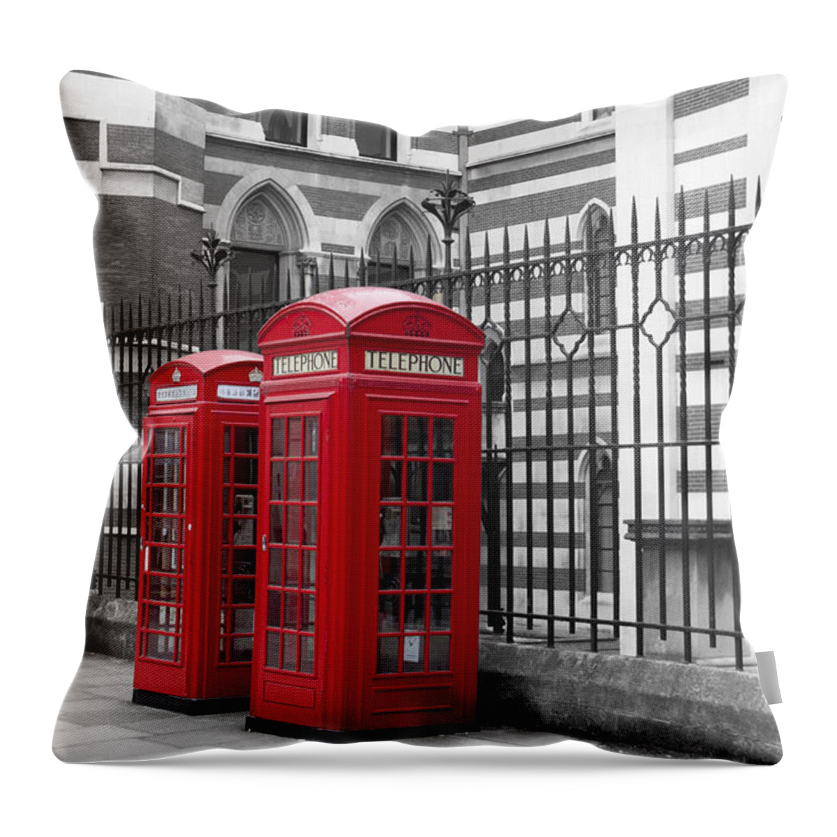 Red Telephone Boxes Outside The Law Courts In London Bw Throw Pillow featuring the photograph Red telephone boxes by David French