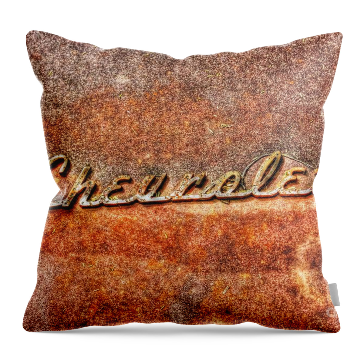 Old Throw Pillow featuring the photograph Rusted Antique Chevrolet Logo by Dan Stone