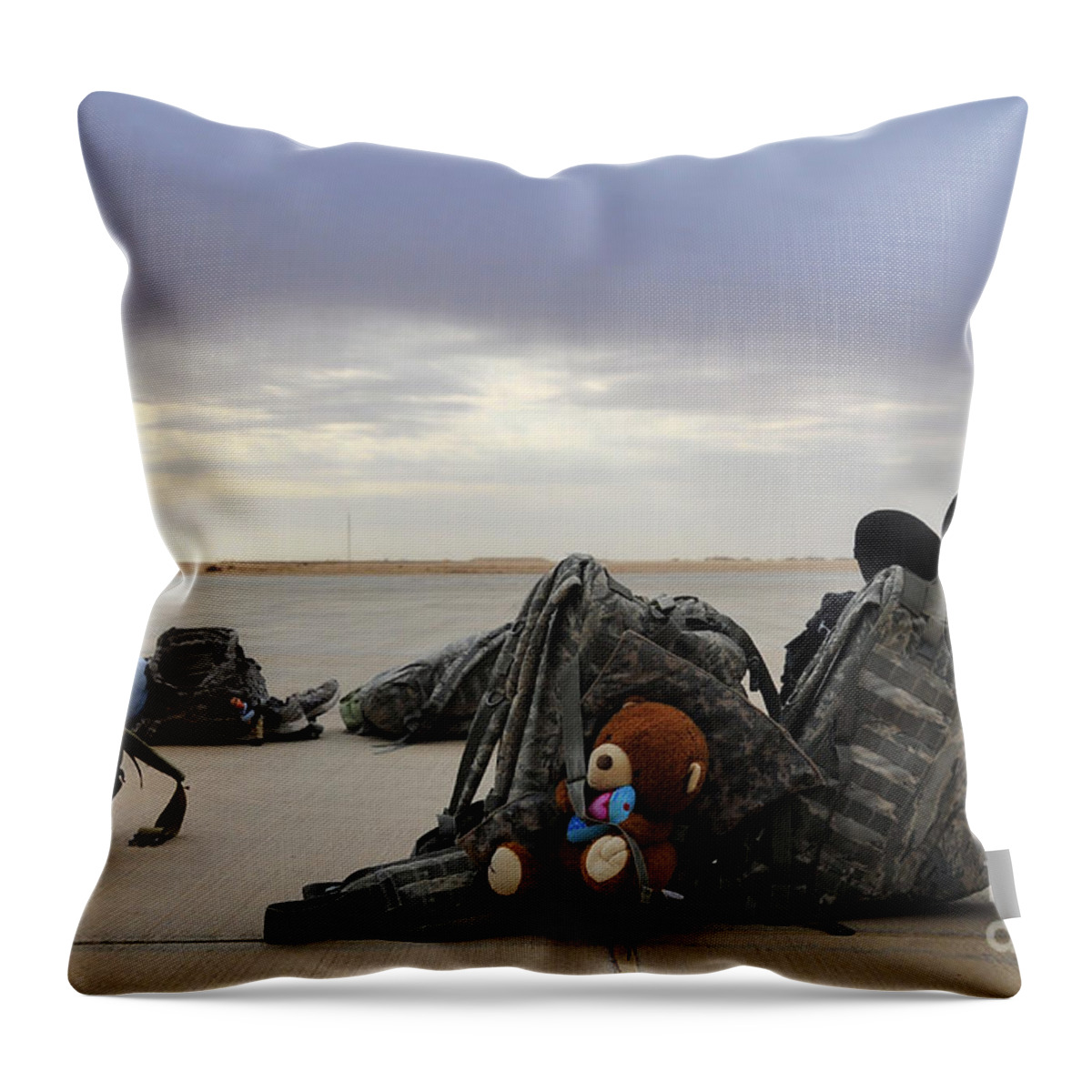 Iraq Throw Pillow featuring the photograph Soldiers Backpacks On The Flight Line by Stocktrek Images
