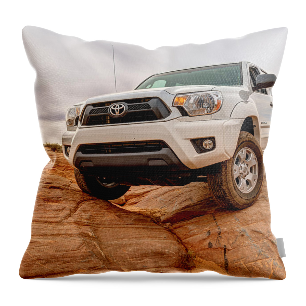 4 Wheel Drive Throw Pillow featuring the photograph Toyota Tacoma at Arches #1 by Brett Engle
