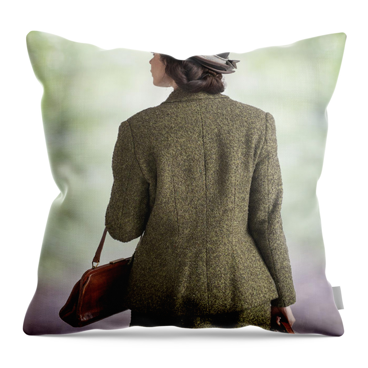 1940s Throw Pillow featuring the photograph 1940s Woman Walking With Leather Suitcase And Handbag by Lee Avison
