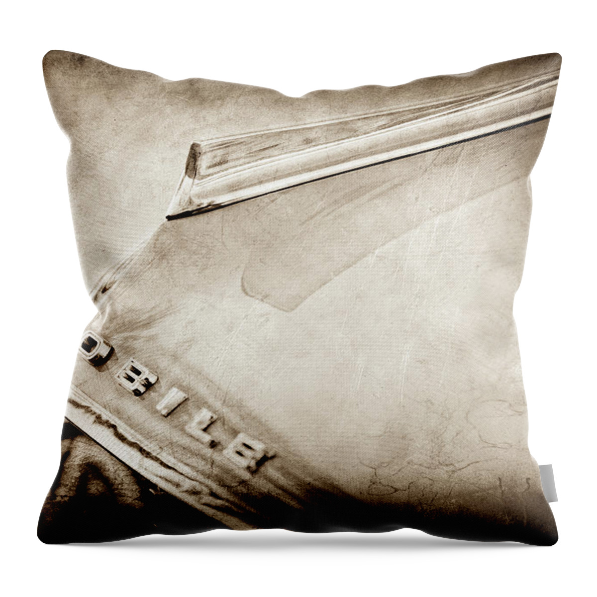 1962 Oldsmobile Hood Ornament And Emblem Throw Pillow featuring the photograph 1962 Oldsmobile Hood Ornament and Emblem -0598s by Jill Reger
