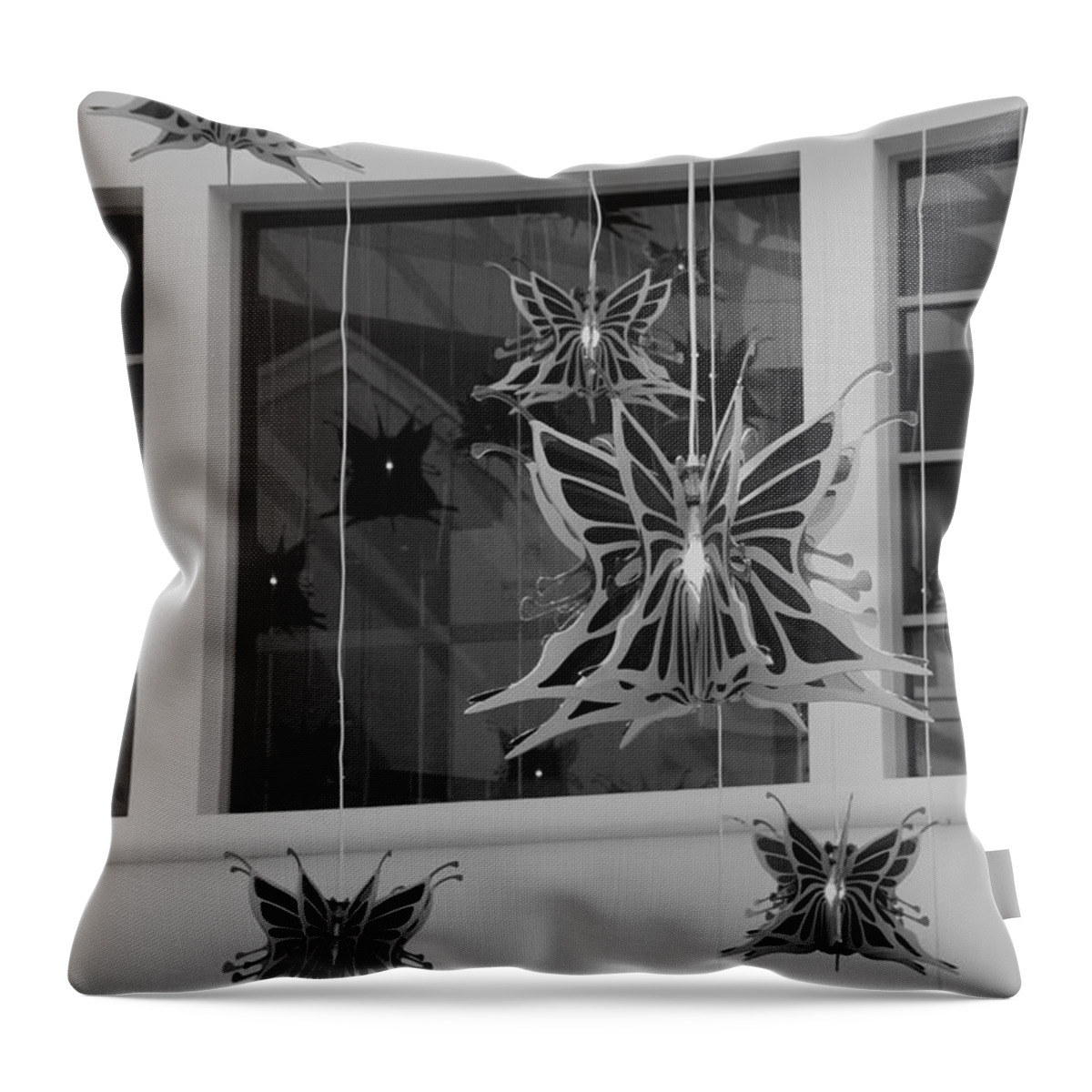 Black And White Throw Pillow featuring the photograph Hanging Butterflies #3 by Rob Hans