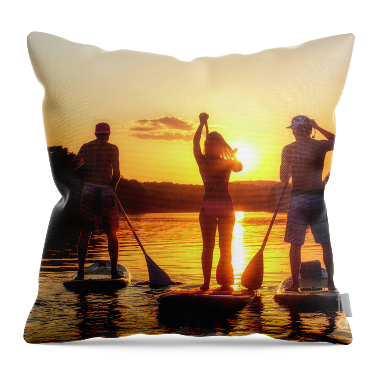 Stand Up Paddle Boarding (sup) Throw Pillow featuring the photograph A group of friends, silhouetted by the sunset, exercise on stand-up paddle boards on Lady Bird Lake in Austin, Texas by Dan Herron