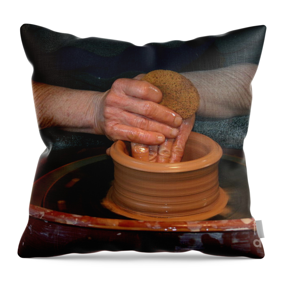 Pottery Throw Pillow featuring the photograph A Potter's Hands by Marie Neder