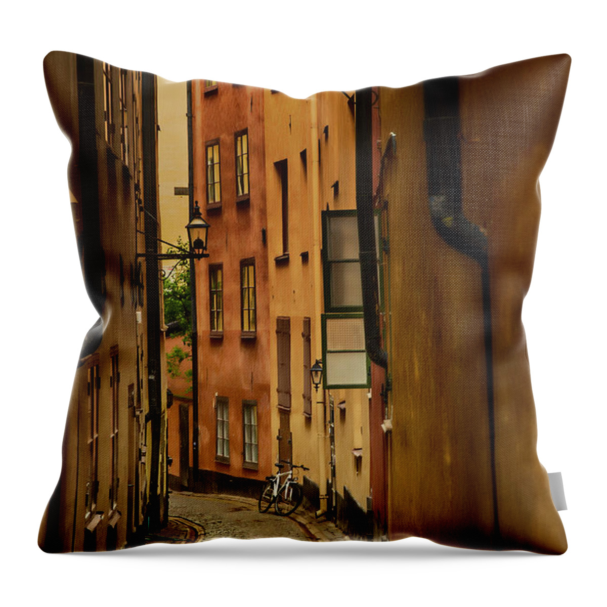 Stockholm Throw Pillow featuring the photograph A Side Street in Stockholm by Mick Burkey