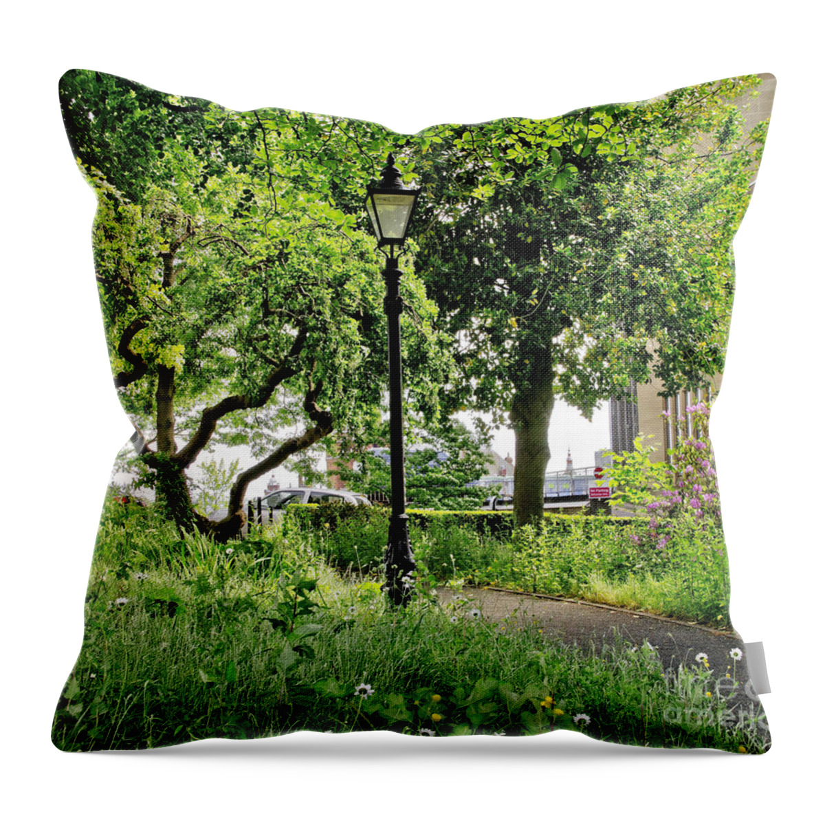 Lamppost Throw Pillow featuring the photograph Among trees and bushes. by Elena Perelman