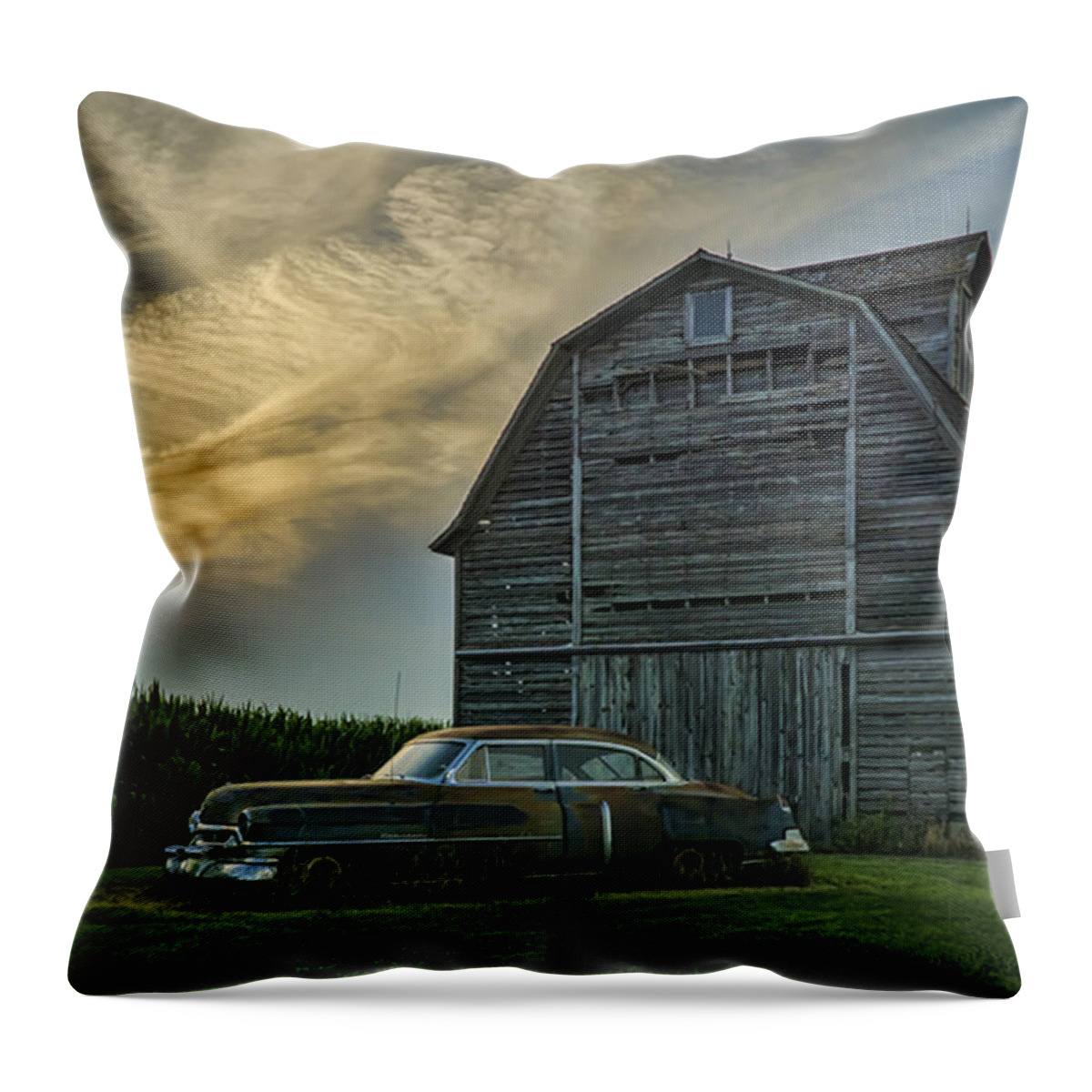 Cadillac Throw Pillow featuring the photograph An Old Cadillac by a barn and cornfield by Sven Brogren