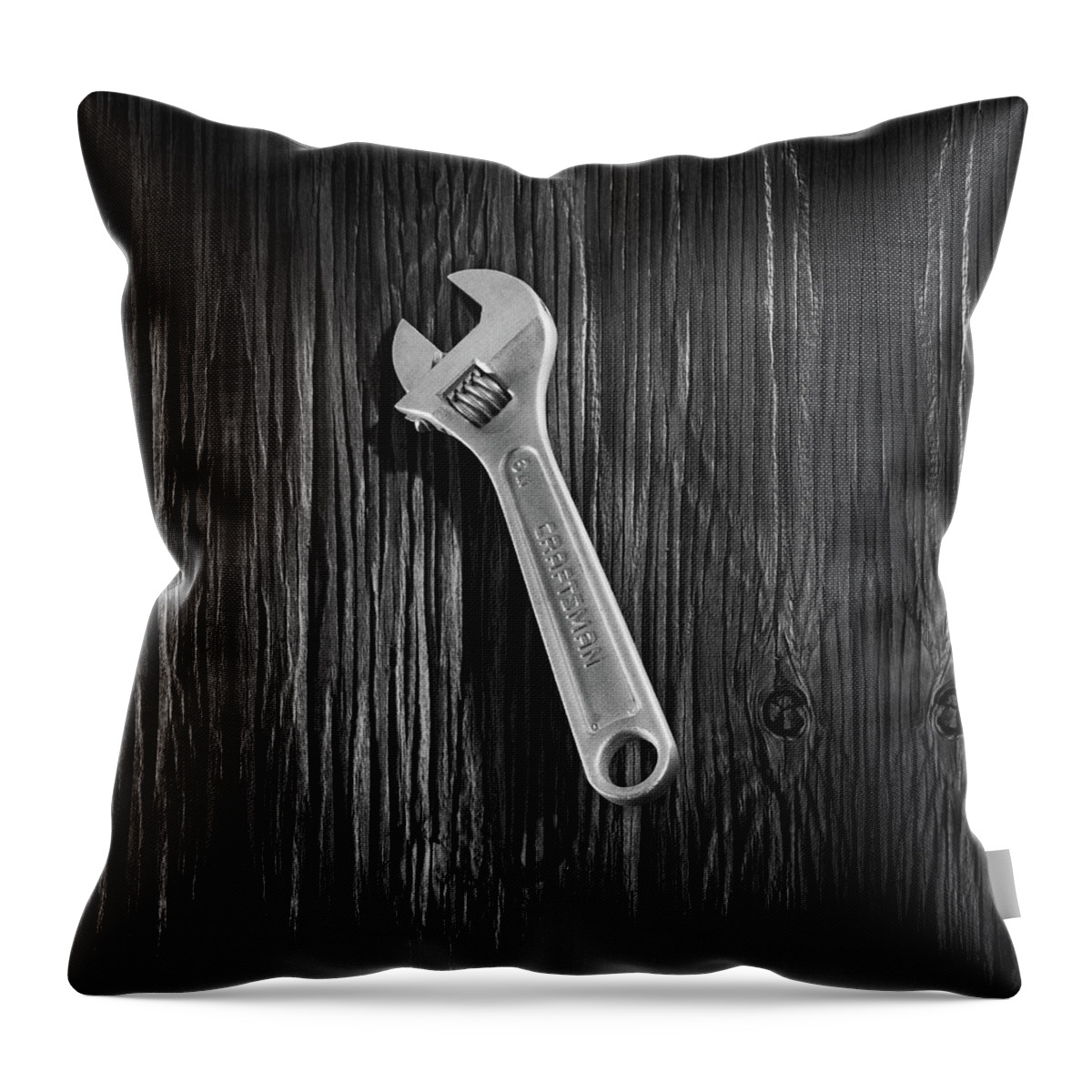 Black Throw Pillow featuring the photograph Adjustable Wrench over Wood 72 in Black and White by YoPedro
