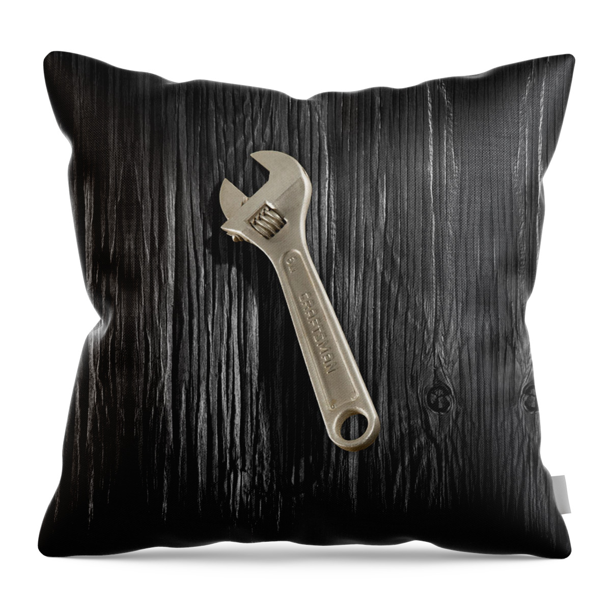 Black Throw Pillow featuring the photograph Adjustable Wrench over Black and White Wood 72 by YoPedro