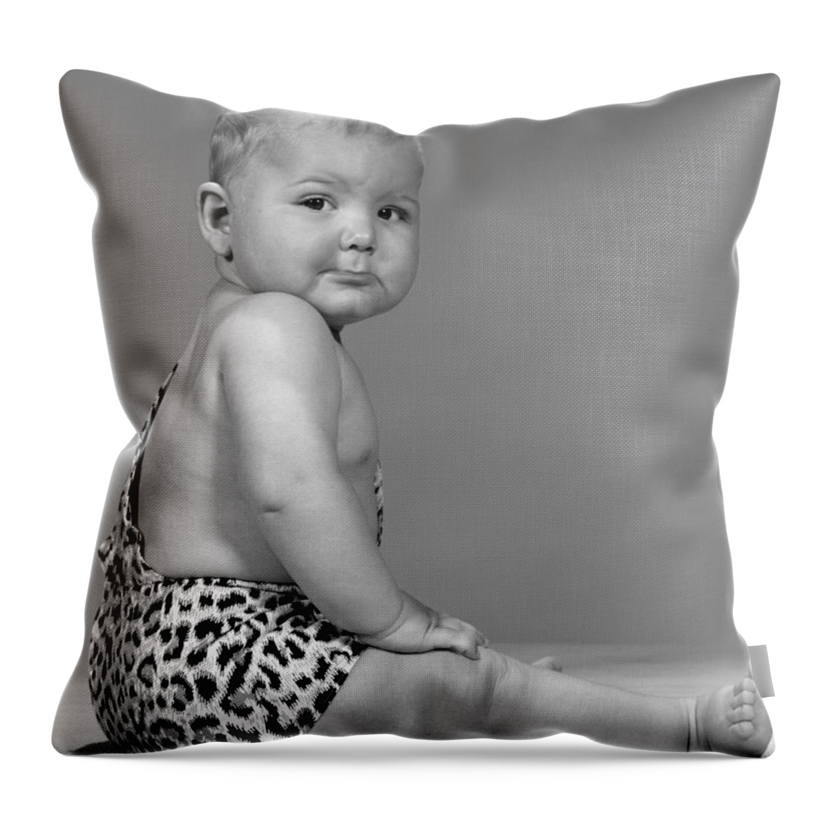 1960s Throw Pillow featuring the photograph Baby With Grumpy Look, C.1960s by H. Armstrong Roberts/ClassicStock