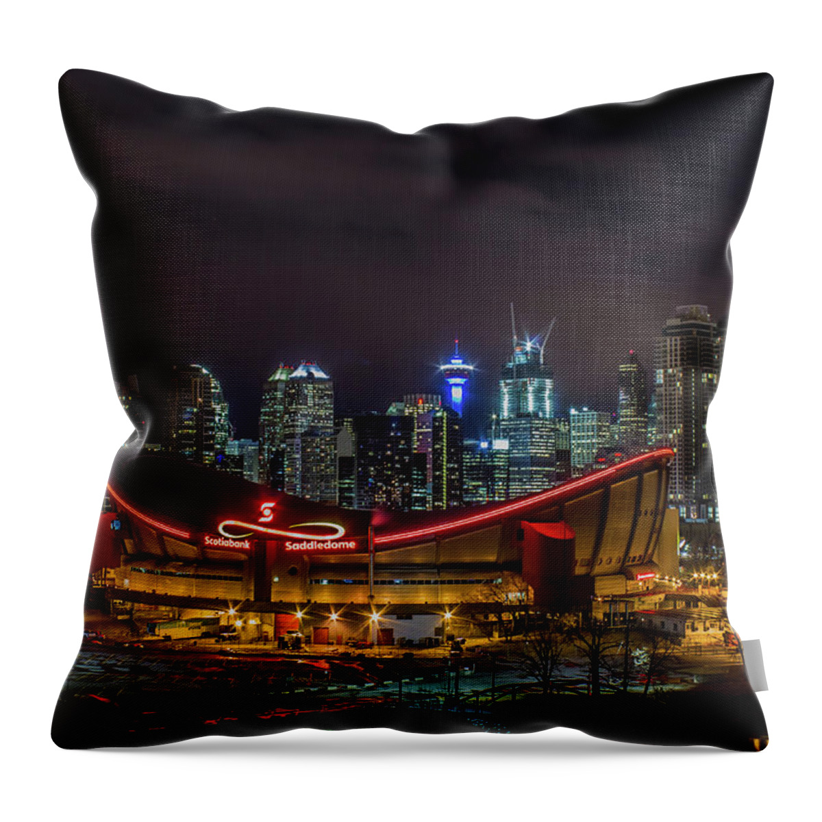 Calgary Throw Pillow featuring the photograph Calgary and the Saddledome at night by Jay Smith