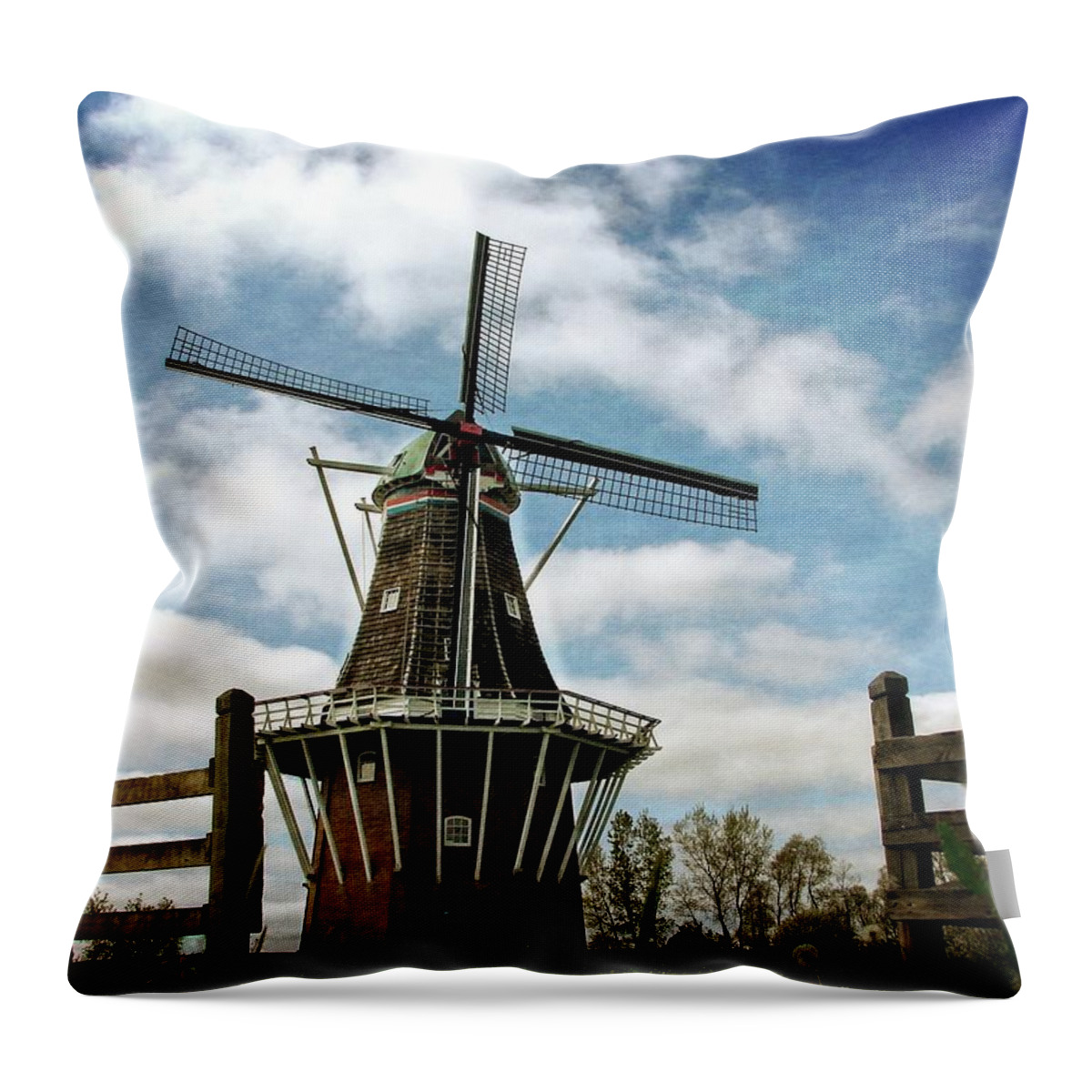 Dezwaan Throw Pillow featuring the photograph DeZwaan Windmill with Fence and Clouds by Michelle Calkins
