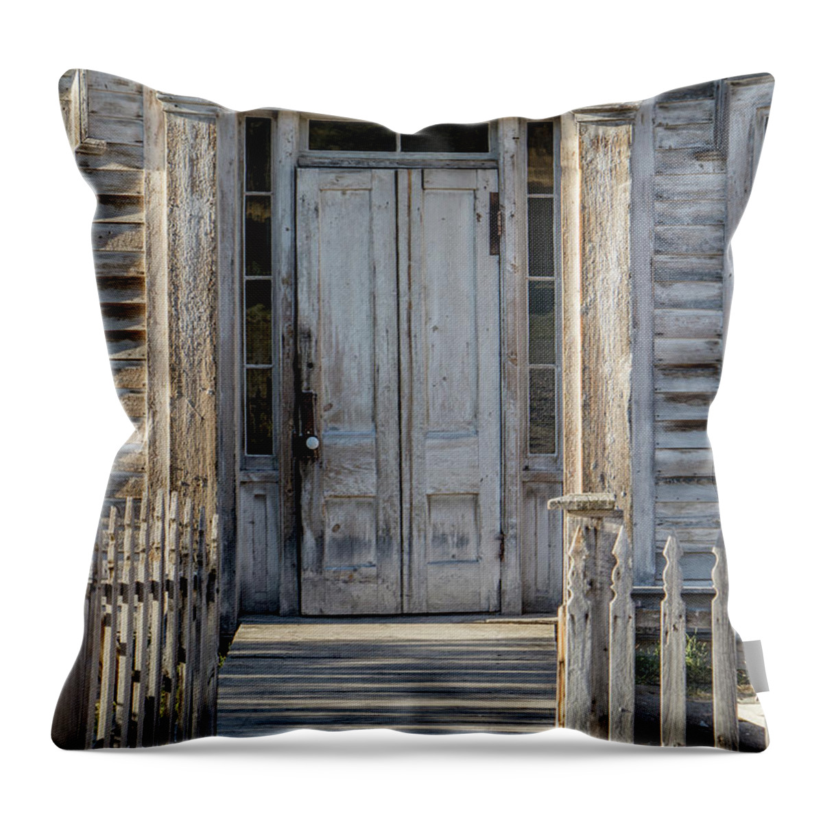 Bannack Throw Pillow featuring the photograph Door of the Old Bannack Schoolhouse and Masonic Temple by Teresa Wilson