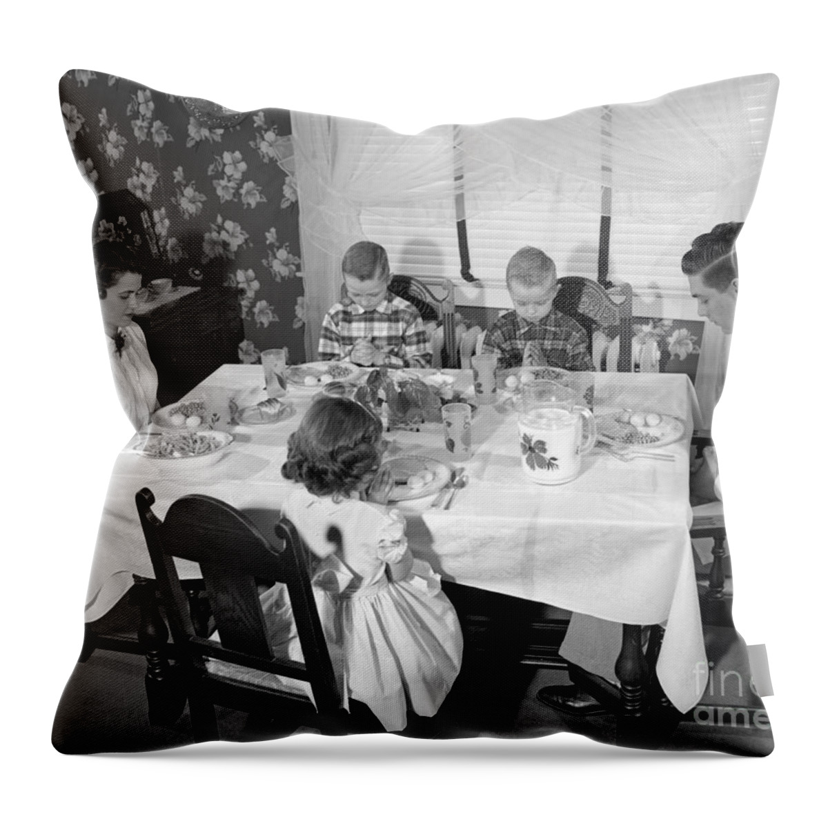 1950s Throw Pillow featuring the photograph Family Saying Grace, C.1950s by H. Armstrong Roberts/ClassicStock