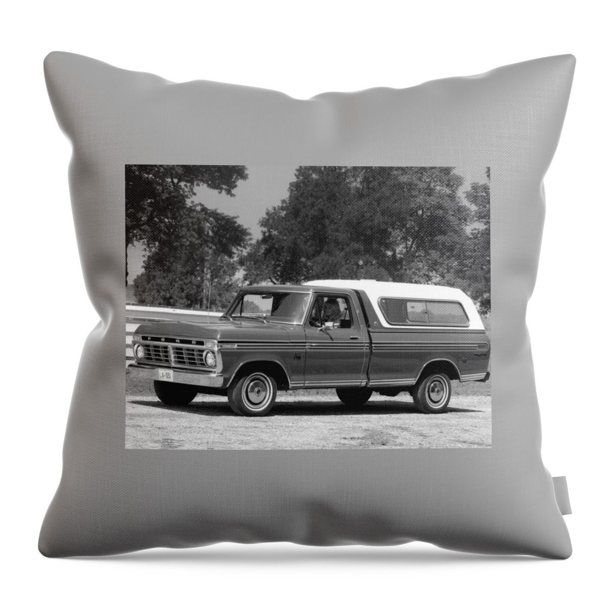Ford Throw Pillow featuring the photograph Ford by Mariel Mcmeeking