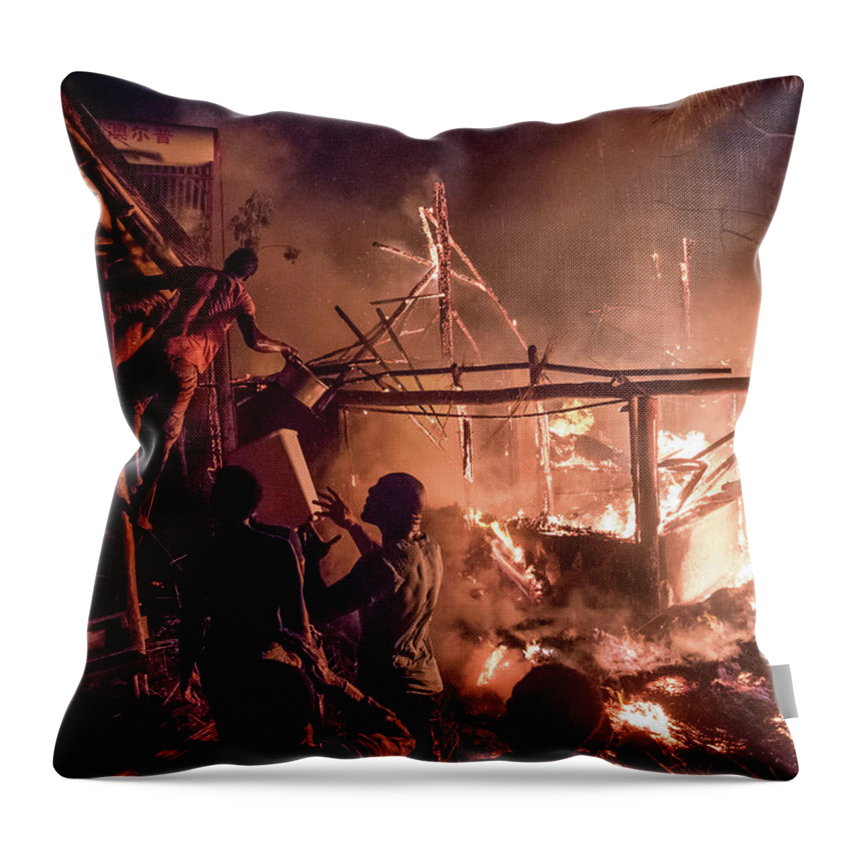 Africa Throw Pillow featuring the photograph Guests and staff did what they could to contain the fire by Gareth Pickering