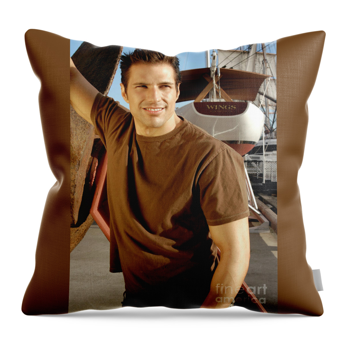 Sailor Throw Pillow featuring the photograph Handsome muscular sailor posing for a portrait photo. by Gunther Allen