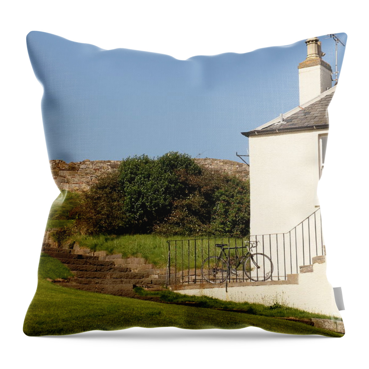 House On The Slope Throw Pillow featuring the photograph House on the slope with a bike and a lamppost. by Elena Perelman