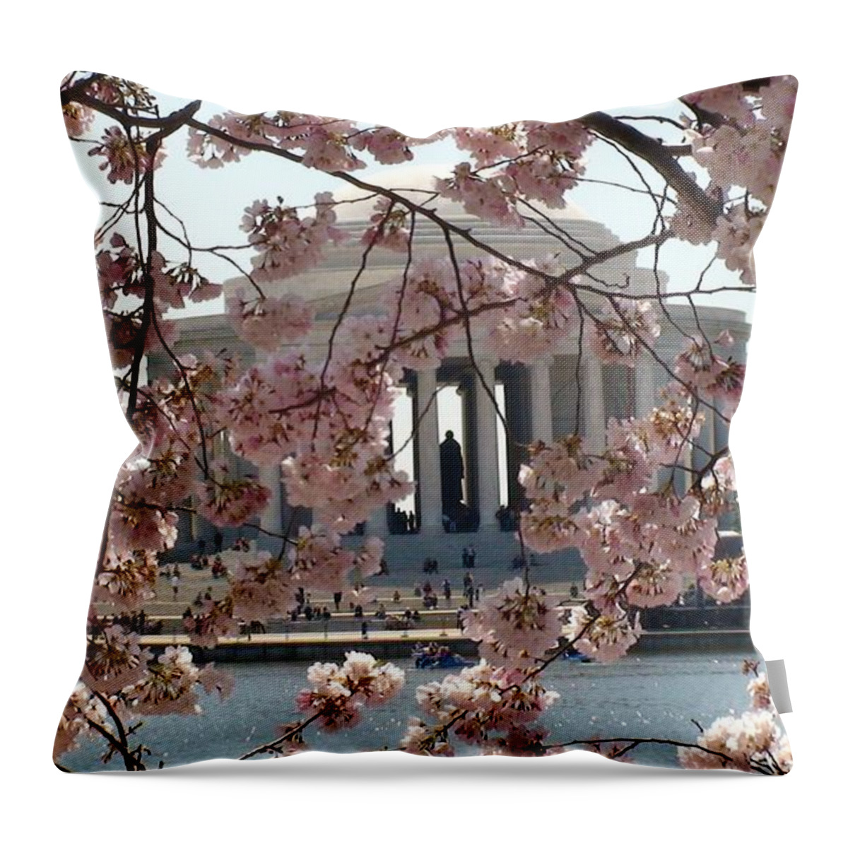 Jefferson Memorial Throw Pillow featuring the photograph Jefferson Through the Cherry Blossoms by Charles Kraus