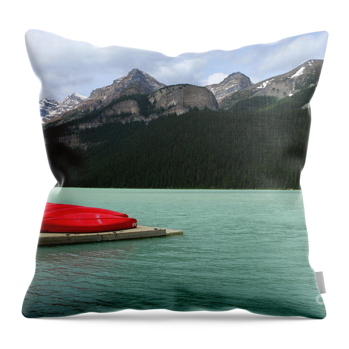 Mountain Throw Pillow featuring the photograph Lake Louise Red Canoes by Christiane Schulze Art And Photography