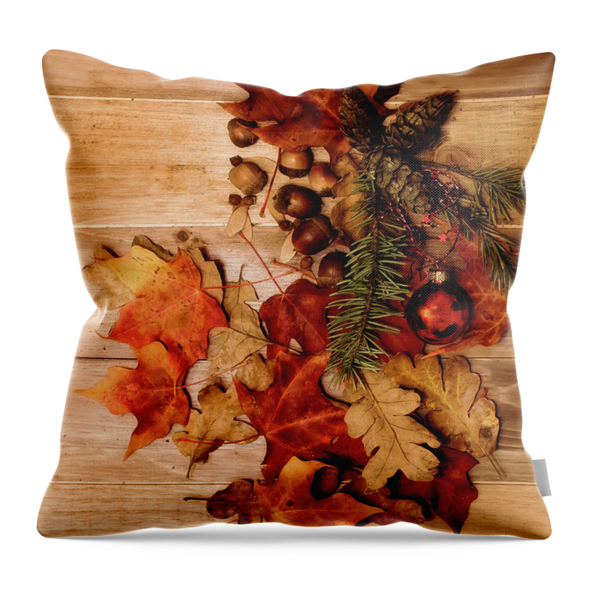 Leaves Throw Pillow featuring the photograph Leaves and Nuts and Red Ornament by Rebecca Cozart