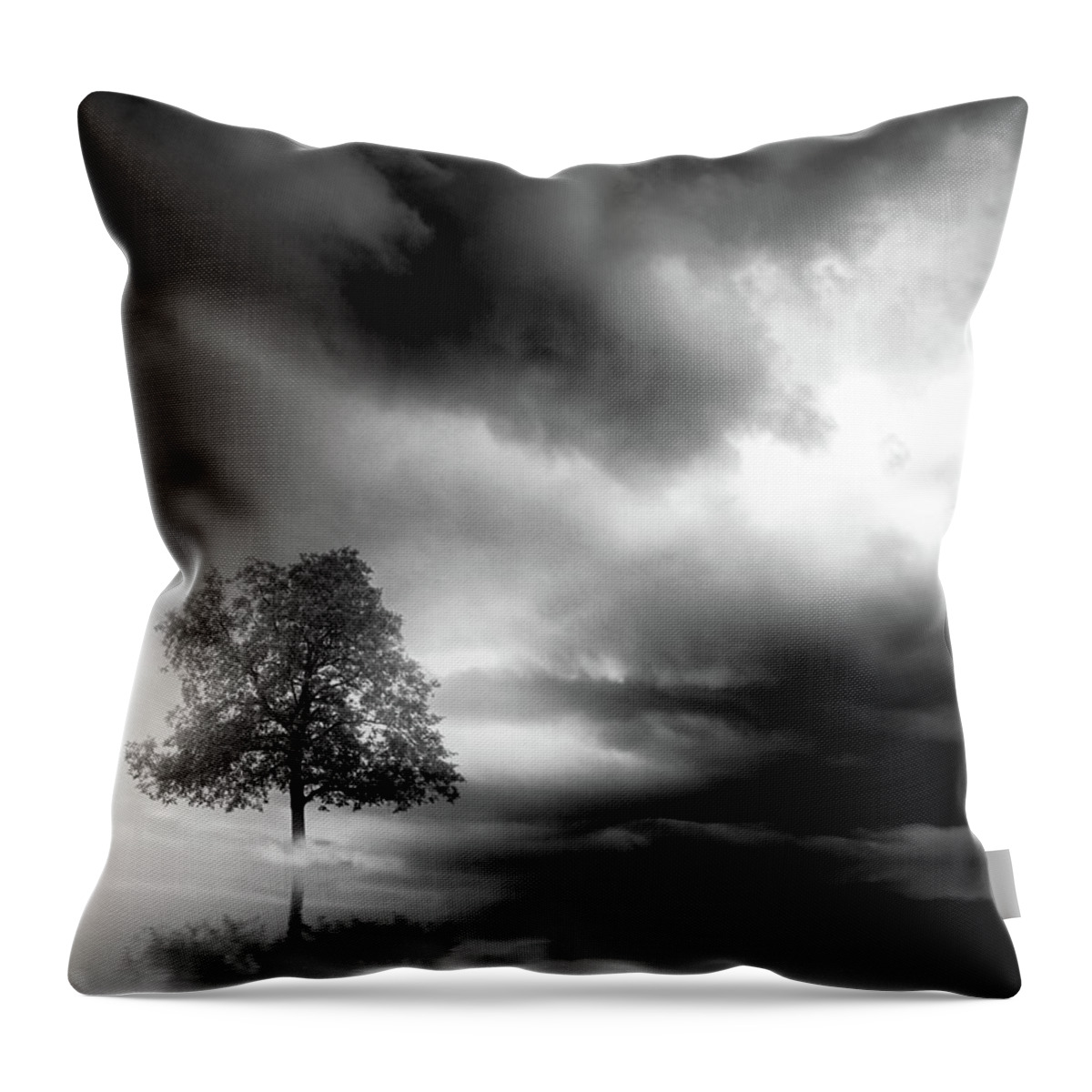 Tree Throw Pillow featuring the digital art Lonely tree and dramatic sky - black and white by Lilia S