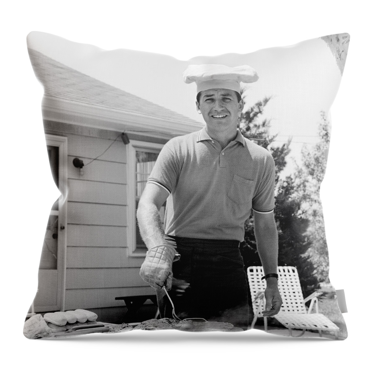 1960s Throw Pillow featuring the photograph Man Cooking Out, C.1960s by H. Armstrong Roberts/ClassicStock