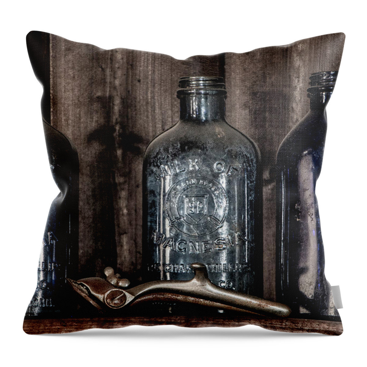 Old Throw Pillow featuring the photograph Milk of Magnesia Bottles by Teresa Wilson