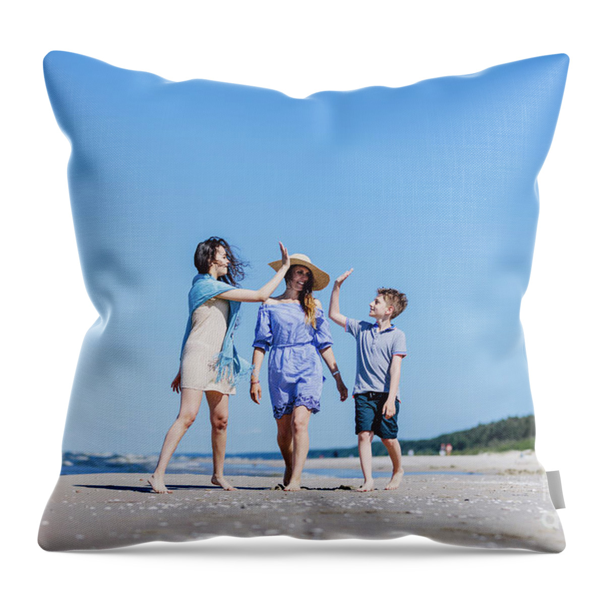 Family Throw Pillow featuring the photograph Mother with children walking by the sea by Michal Bednarek