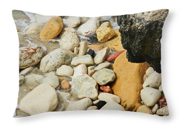  Multi Colored Beach Rocks Are Washed In A Wave At The Ocean Edge Throw Pillow featuring the photograph multi colored Beach rocks by Priscilla Batzell Expressionist Art Studio Gallery